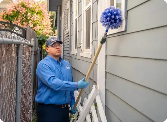 Technician applying general pest treatment