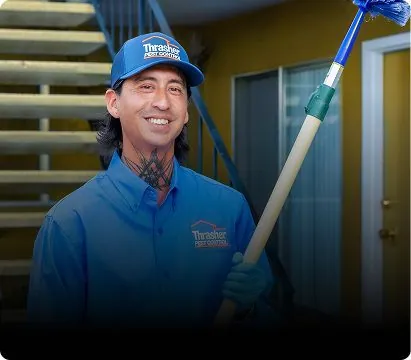 Thrasher technician talking with a homeowner